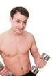 Young man with naked torso with dumbbells in sport club on white Young man with naked torso with dumbbells in sport club on white
