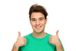 Casual young guy showing thumbs up Casual young guy showing thumbs up