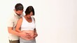 Man stroking the belly of his pregnant woman