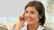 Cute businesswoman speaking over the headset