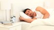 Young man sleeping on his bed