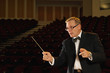 Male symphony conductor in action
