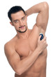 Foto: Young handsome man applying perfume Young handsome man applying perfume