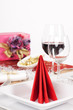 Close-up view of red napkin arranged on white plate Close-up view of red napkin arranged on white plate