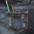 texture of blue jeans pocket with a ruler and pencil texture of blue jeans pocket with a ruler and pencil