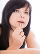 a beautiful girl is cutting her tongue with a blade (imitation) a beautiful girl is cutting her tongue with a blade (imitation)
