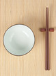 Chopsticks and bowl on bamboo cover Chopsticks and bowl on bamboo cover