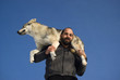Man playing with dog