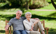 Foto: Senior couple sitting on a bench Senior couple sitting on a bench