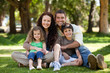 Happy family sitting in the garden