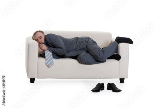 Foto: businessman sleeping on a sofa businessman sleeping on a sofa