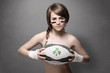 Young teenager girl with rugby ball