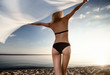 young gorgeous blond at sunset on the beach