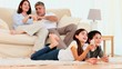 Video: Family laughing in front of tv Family laughing in front of tv