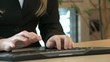 Woman sits at computer