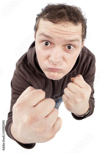 Photo: Funny young man punching Funny young man punching