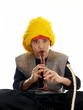 boy playing the flute charming a rope