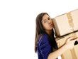 teenage girl carrying carton boxes