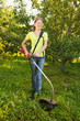 Girl works with trimmer