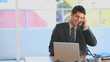 Handsome businessman talking on the phone
