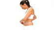 Good looking woman checking her waistline