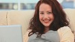 Beautiful woman smiling with her laptop