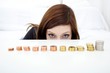 beautiful woman with growing money (focus on face)