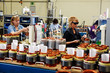 female skilled industrial workers mounting electric motors 01