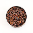 Coffee beans in round metallic plate