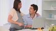 Future parents using a laptop