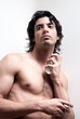 Photo: Cosmetic wellness spa man spraying fragrance Cosmetic wellness spa man spraying fragrance