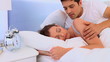 Lovely couple waking up in their bed