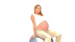Pregnant woman doing streches against a white background