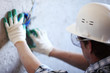 worker puts the wires