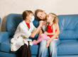 A doctor examining a child
