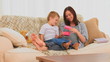 Mother and her son opening a gift