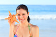 Pretty woman with a starfish