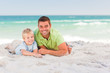 Happy father with his son at the beach