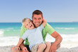 Attentive father with his son at the beach