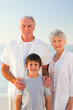 Grandparents with his grandson at the beach
