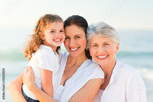 Photo: Lovely family at the beach Lovely family at the beach