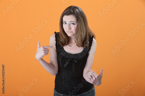 Photo: Woman Points to Herself Woman Points to Herself