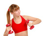 Beautiful young girl doing fitness exercises.