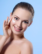 Smiling teen girl with cream on face