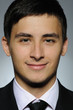 Foto: Portrait of smiling business man in formal suit and black tie . Portrait of smiling business man in formal suit and black tie .
