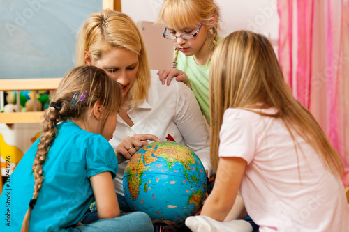 Photo: Mother explaining the world to her children Mother explaining the world to her children