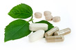 Natural pills with green leaf