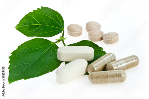 Photo: Natural pills with green leaf Natural pills with green leaf