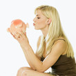Photo: woman's portrait with a piggy bank woman's portrait with a piggy bank