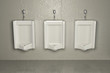 Urinals on dirty wall. Abstract background